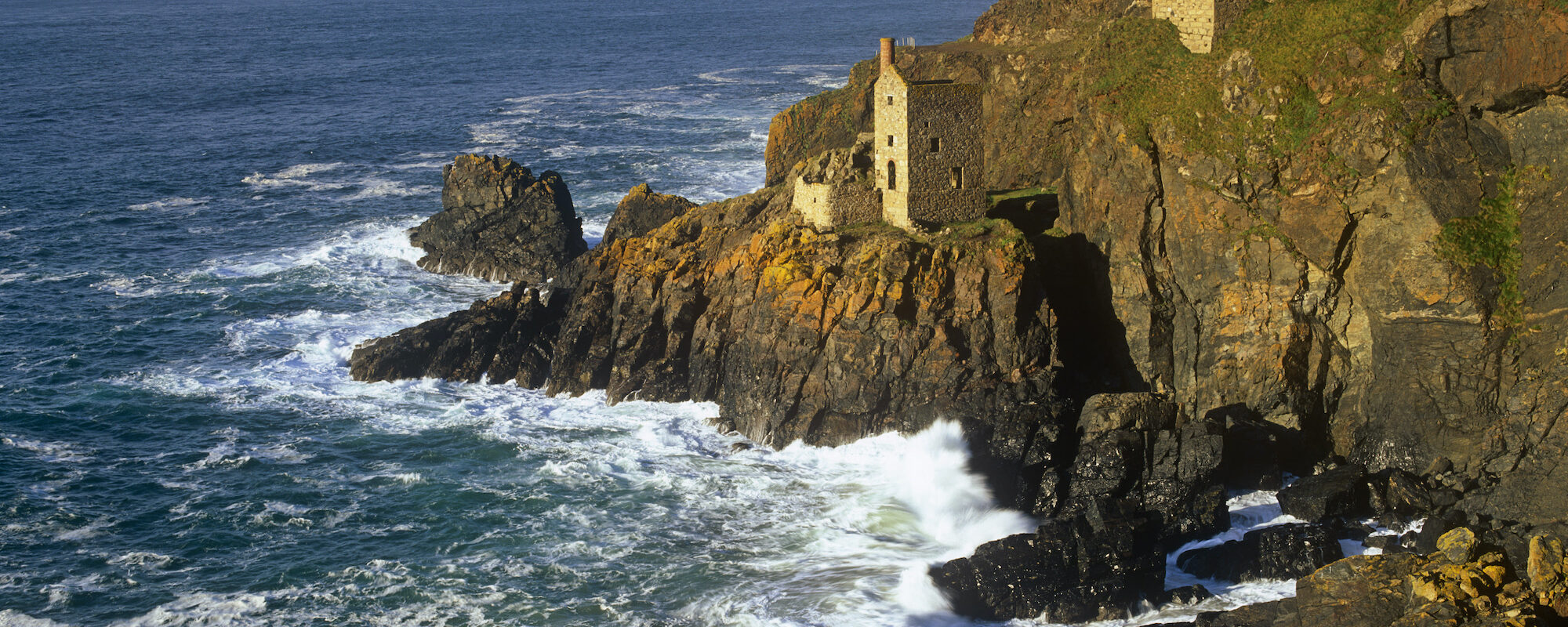 The abandoned beam engine houses of the Crowns section of Botallack Mine near St Just, Cornwall.