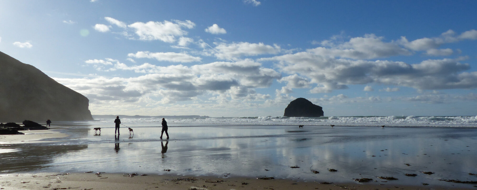 Visitors on the beach at Trebarwith Strand, North Cornwall