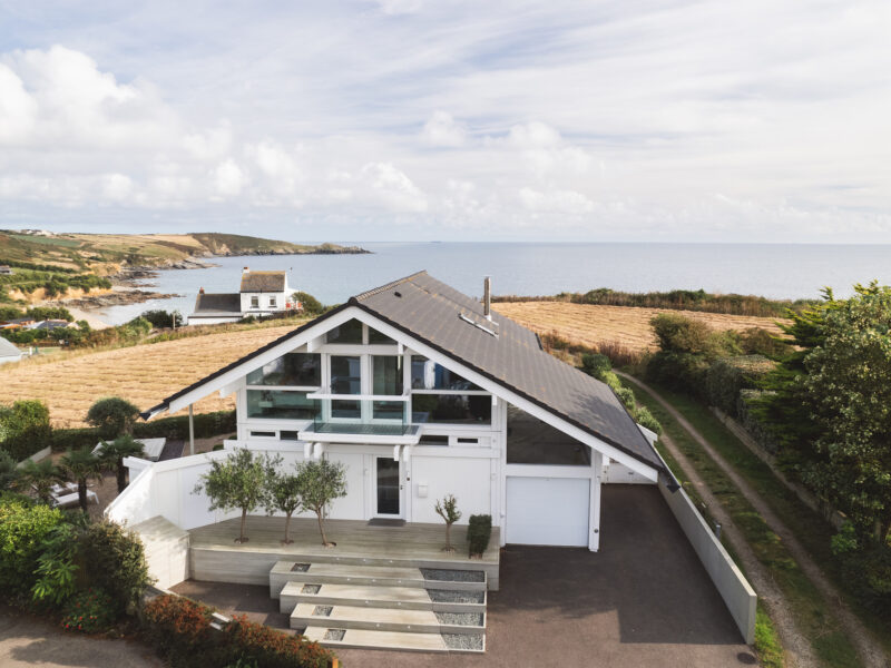 House drone view of Front of house and sea South