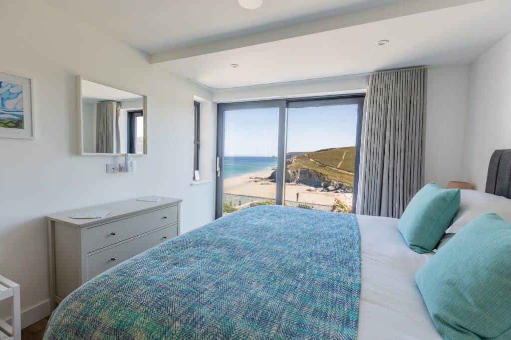 Sea view bedroom at Cornish Secrets with ocean vistas and tranquil coastal scenery.