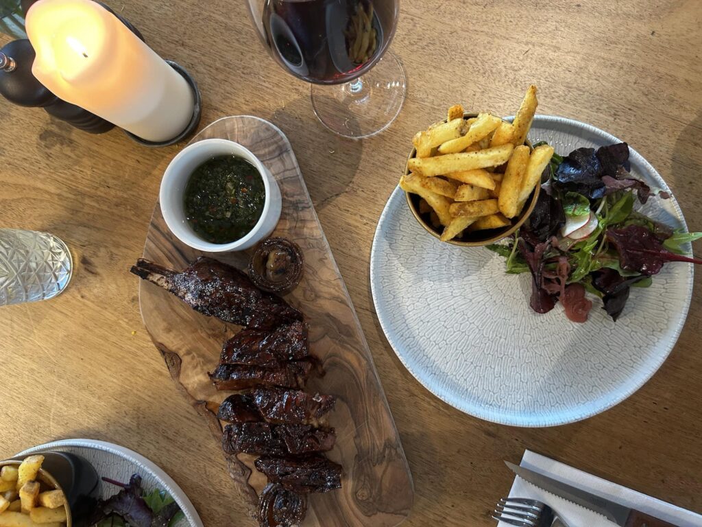 Steak with fries and salad at Cornish Secrets restaurant.