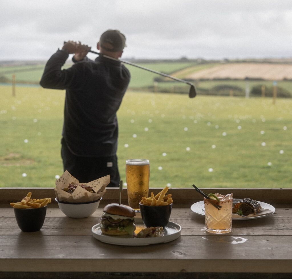 Golfing at Halwyn with food and drinks on a sunny day.