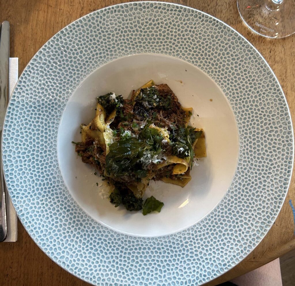 Cornish Secrets pasta with greens and rich sauce.