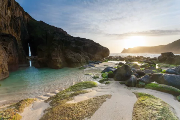 Sunset at Nanjizal, also known as Mill Bay, a beach and cove near Lands End, Cornwall Cornwall England UK Europe. ©Ian Woolcock Shutterstock